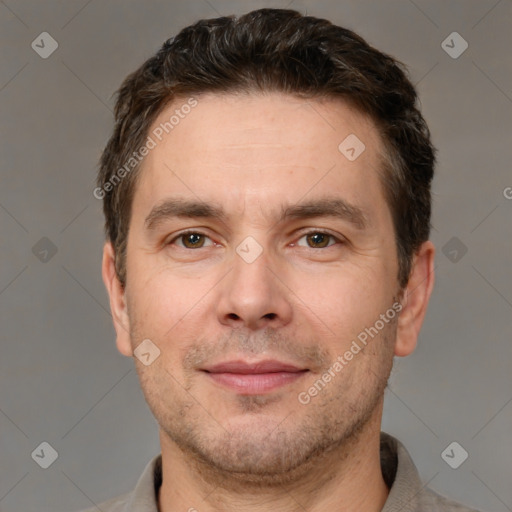 Joyful white adult male with short  brown hair and brown eyes