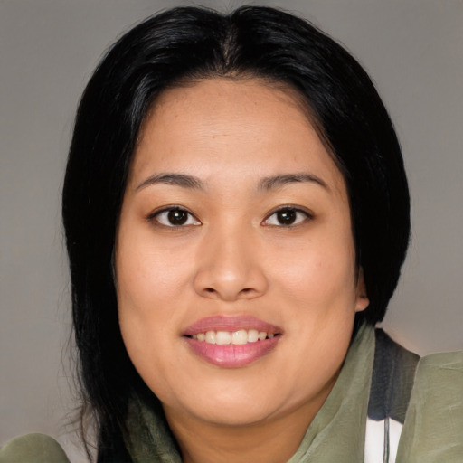 Joyful asian young-adult female with medium  black hair and brown eyes