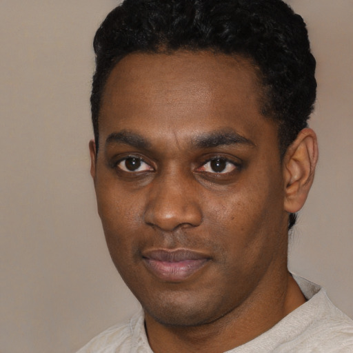 Neutral black young-adult male with short  black hair and brown eyes