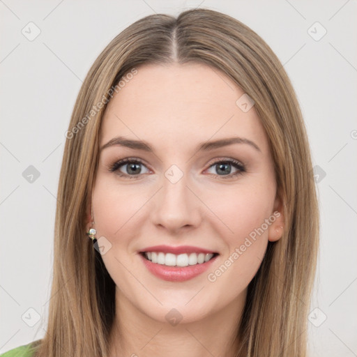 Joyful white young-adult female with long  brown hair and green eyes