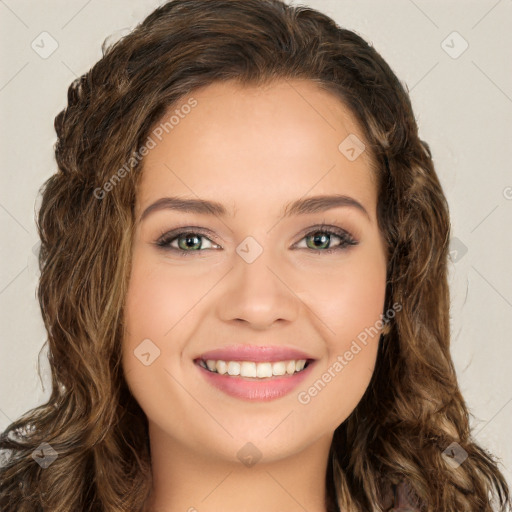 Joyful white young-adult female with long  brown hair and green eyes