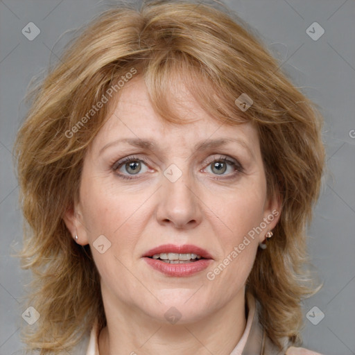 Joyful white adult female with medium  brown hair and blue eyes