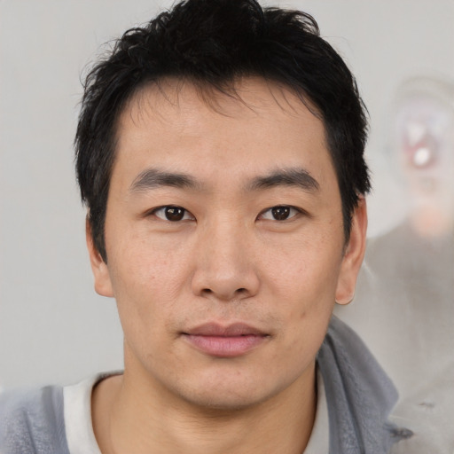 Neutral asian young-adult male with short  black hair and brown eyes