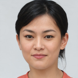 Joyful asian young-adult female with medium  brown hair and brown eyes