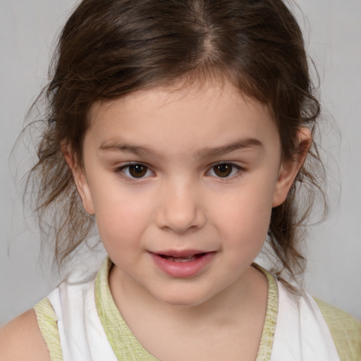 Joyful white child female with medium  brown hair and brown eyes