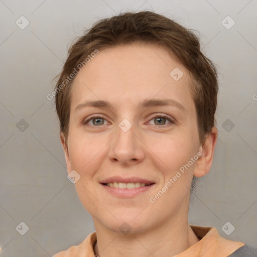 Joyful white young-adult female with short  brown hair and grey eyes