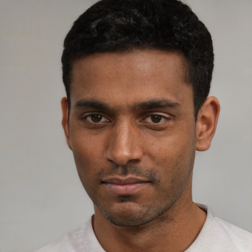Neutral black young-adult male with short  black hair and brown eyes