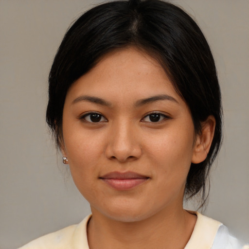 Joyful asian young-adult female with medium  brown hair and brown eyes