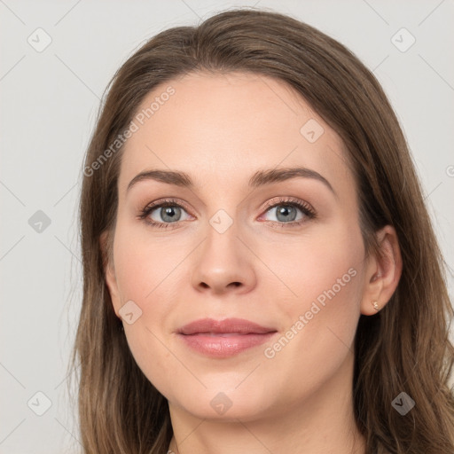 Joyful white young-adult female with long  brown hair and grey eyes