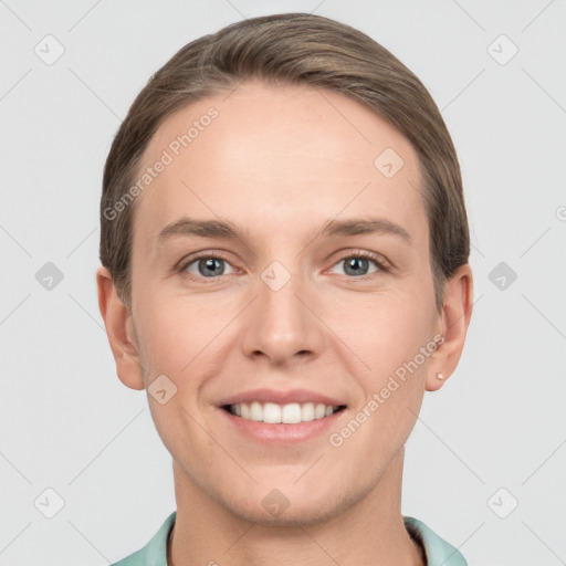 Joyful white young-adult female with short  brown hair and grey eyes