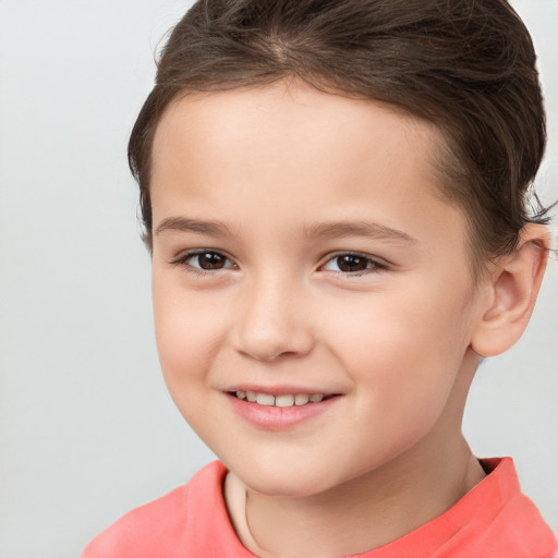 Joyful white child female with short  brown hair and brown eyes