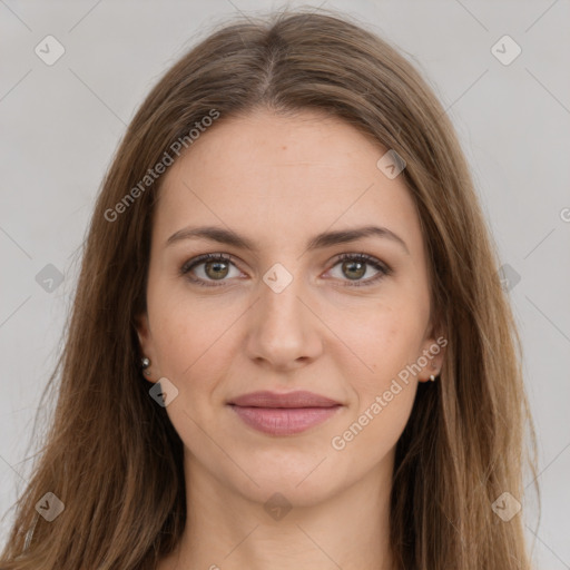 Joyful white young-adult female with long  brown hair and green eyes