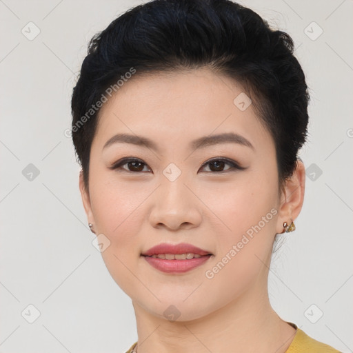 Joyful asian young-adult female with short  black hair and brown eyes