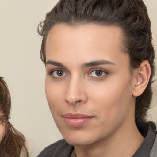 Neutral white young-adult female with medium  brown hair and brown eyes