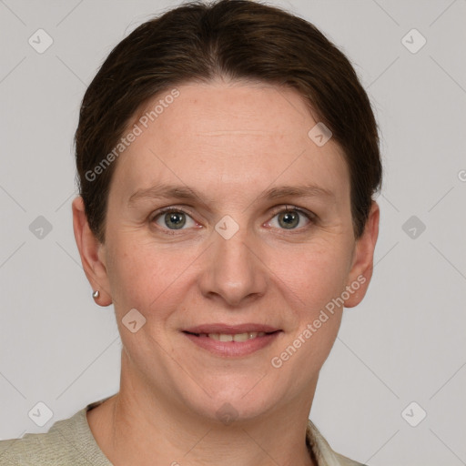 Joyful white adult female with short  brown hair and grey eyes