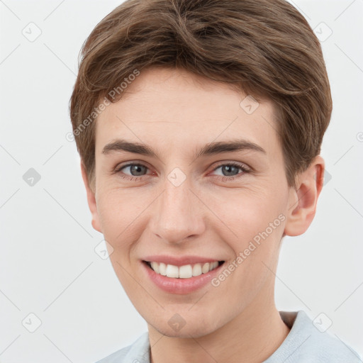 Joyful white young-adult female with short  brown hair and grey eyes