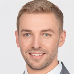 Joyful white young-adult male with short  brown hair and grey eyes