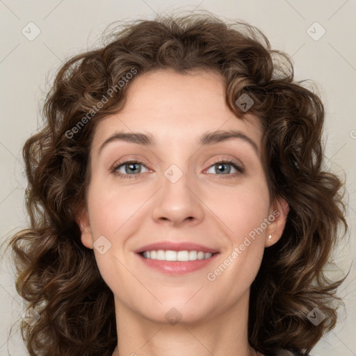 Joyful white young-adult female with medium  brown hair and green eyes