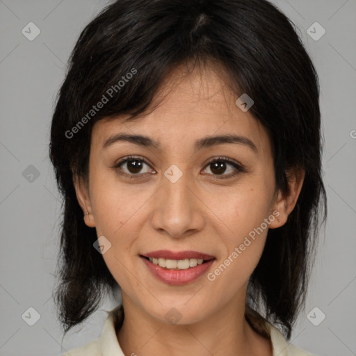 Joyful latino adult female with medium  brown hair and brown eyes