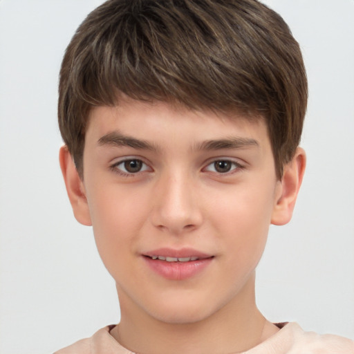 Joyful white child male with short  brown hair and brown eyes