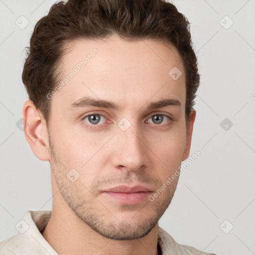 Neutral white young-adult male with short  brown hair and grey eyes