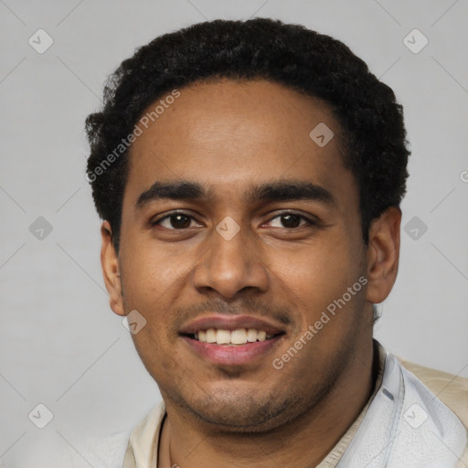 Joyful black young-adult male with short  black hair and brown eyes