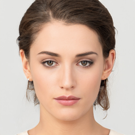 Neutral white young-adult female with medium  brown hair and brown eyes