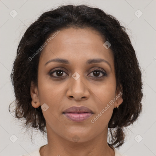 Joyful black young-adult female with medium  brown hair and brown eyes