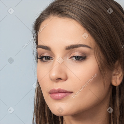 Neutral white young-adult female with long  brown hair and brown eyes