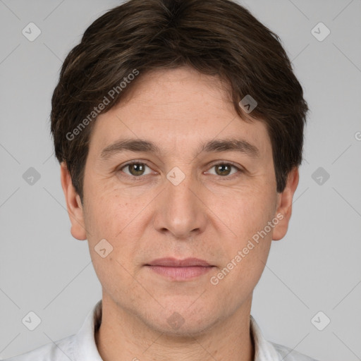 Joyful white adult male with short  brown hair and brown eyes