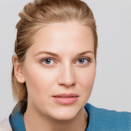 Joyful white young-adult female with medium  brown hair and blue eyes