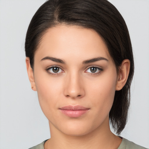 Joyful white young-adult female with medium  brown hair and brown eyes