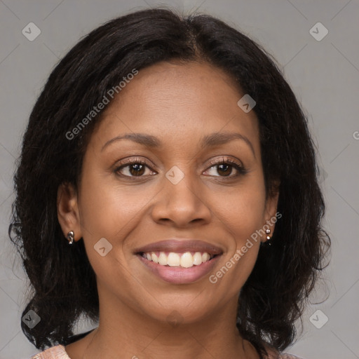 Joyful black young-adult female with medium  brown hair and brown eyes