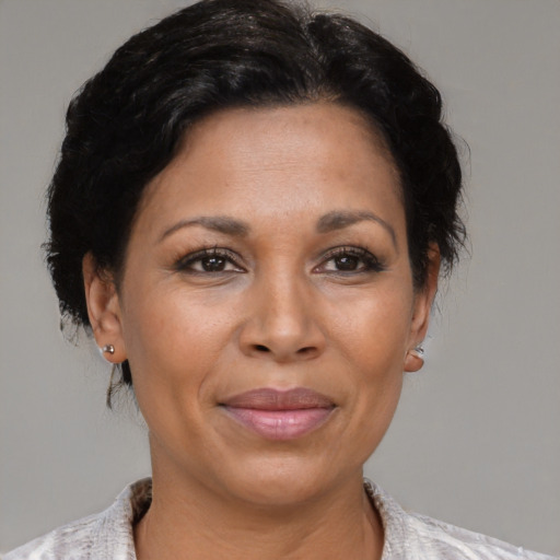 Joyful asian adult female with short  brown hair and brown eyes
