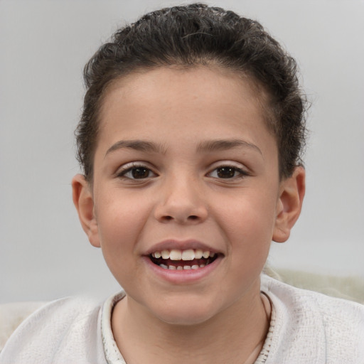 Joyful white child male with short  brown hair and brown eyes