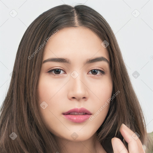 Neutral white young-adult female with long  brown hair and brown eyes