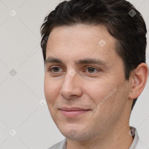 Joyful white adult male with short  brown hair and brown eyes