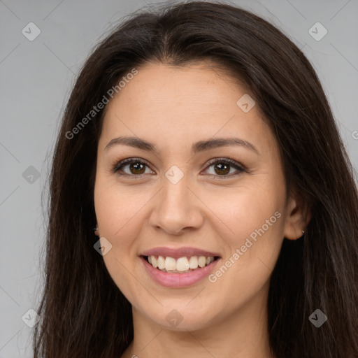 Joyful white young-adult female with long  brown hair and brown eyes