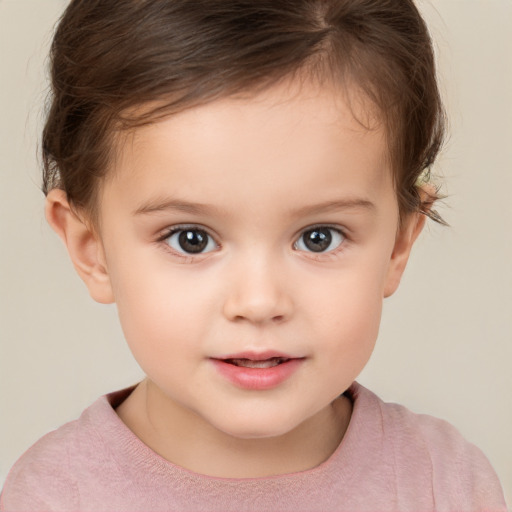 Joyful white child female with short  brown hair and brown eyes