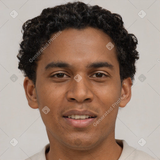 Joyful black young-adult male with short  brown hair and brown eyes