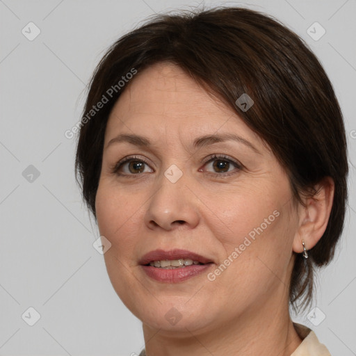 Joyful white adult female with medium  brown hair and brown eyes