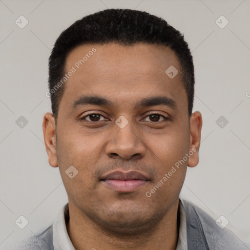 Joyful latino young-adult male with short  black hair and brown eyes