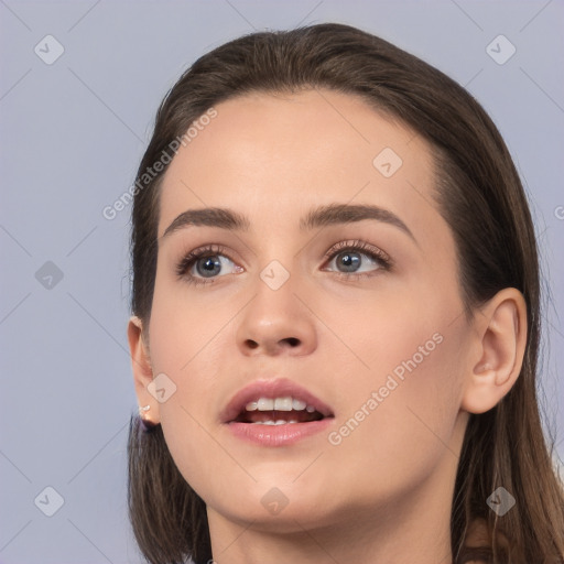 Neutral white young-adult female with long  brown hair and brown eyes