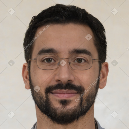 Joyful white adult male with short  black hair and brown eyes