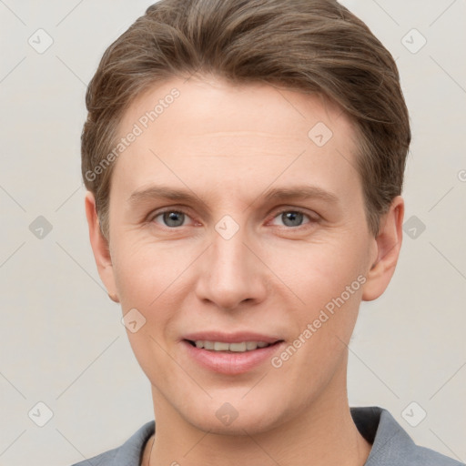 Joyful white young-adult female with short  brown hair and grey eyes