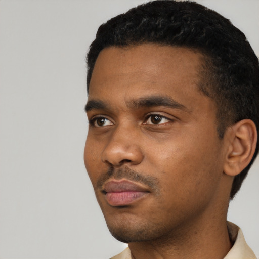 Neutral black young-adult male with short  black hair and brown eyes