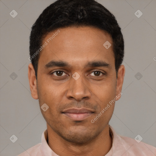 Joyful latino young-adult male with short  black hair and brown eyes