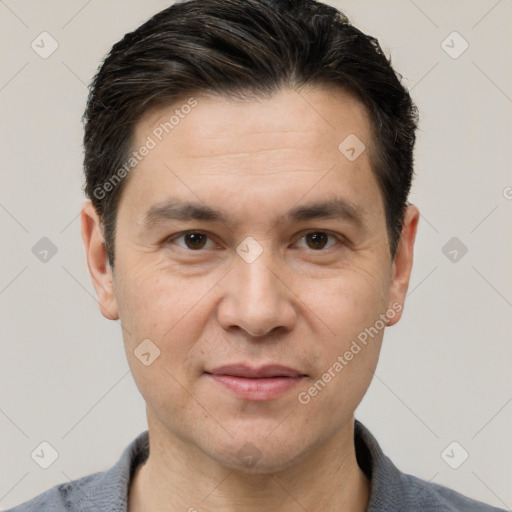 Joyful white adult male with short  brown hair and brown eyes