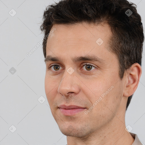 Joyful white adult male with short  brown hair and brown eyes