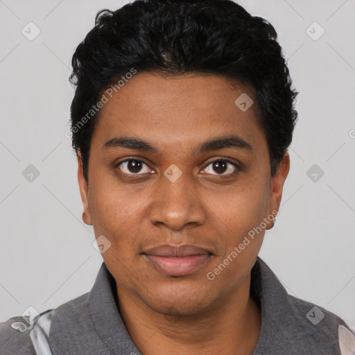 Joyful black young-adult male with short  black hair and brown eyes